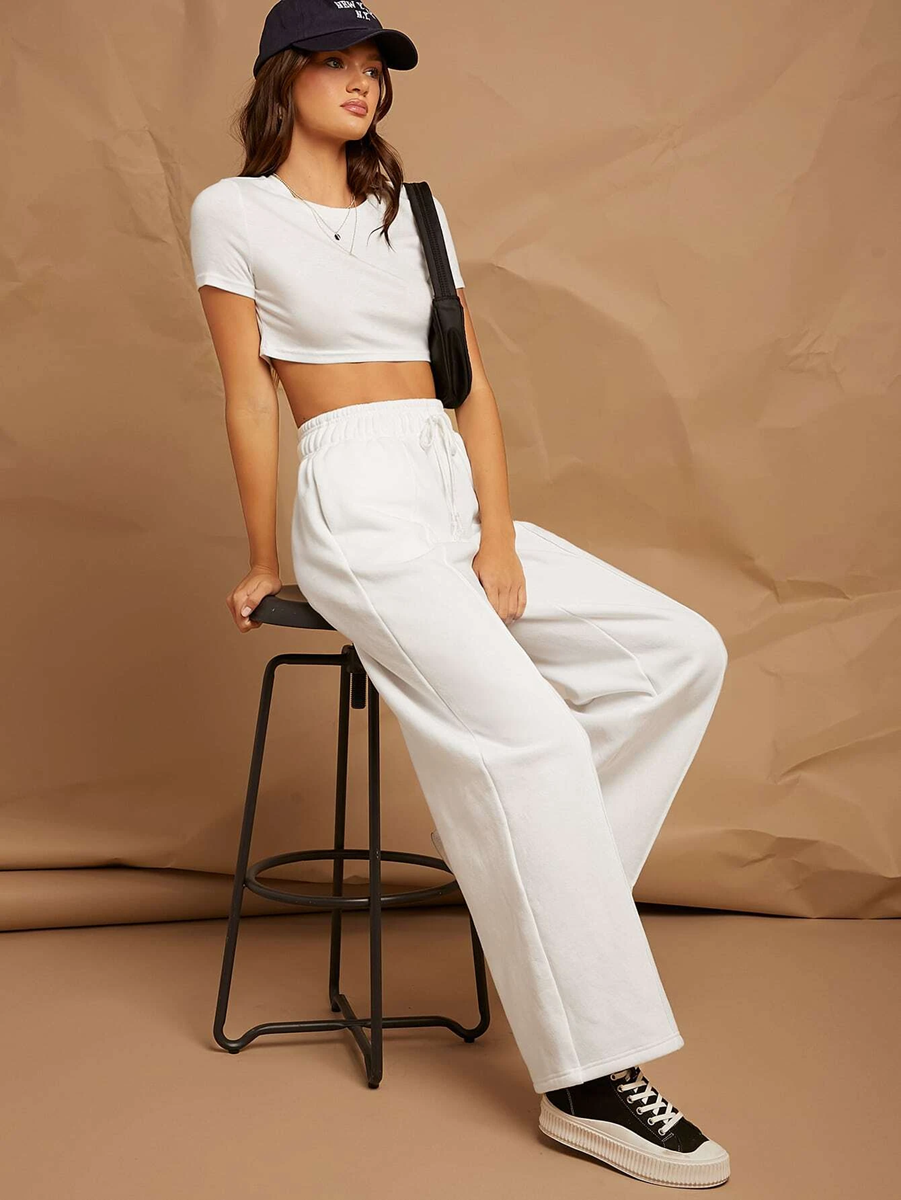 white broad pants with front pleat for athleisure