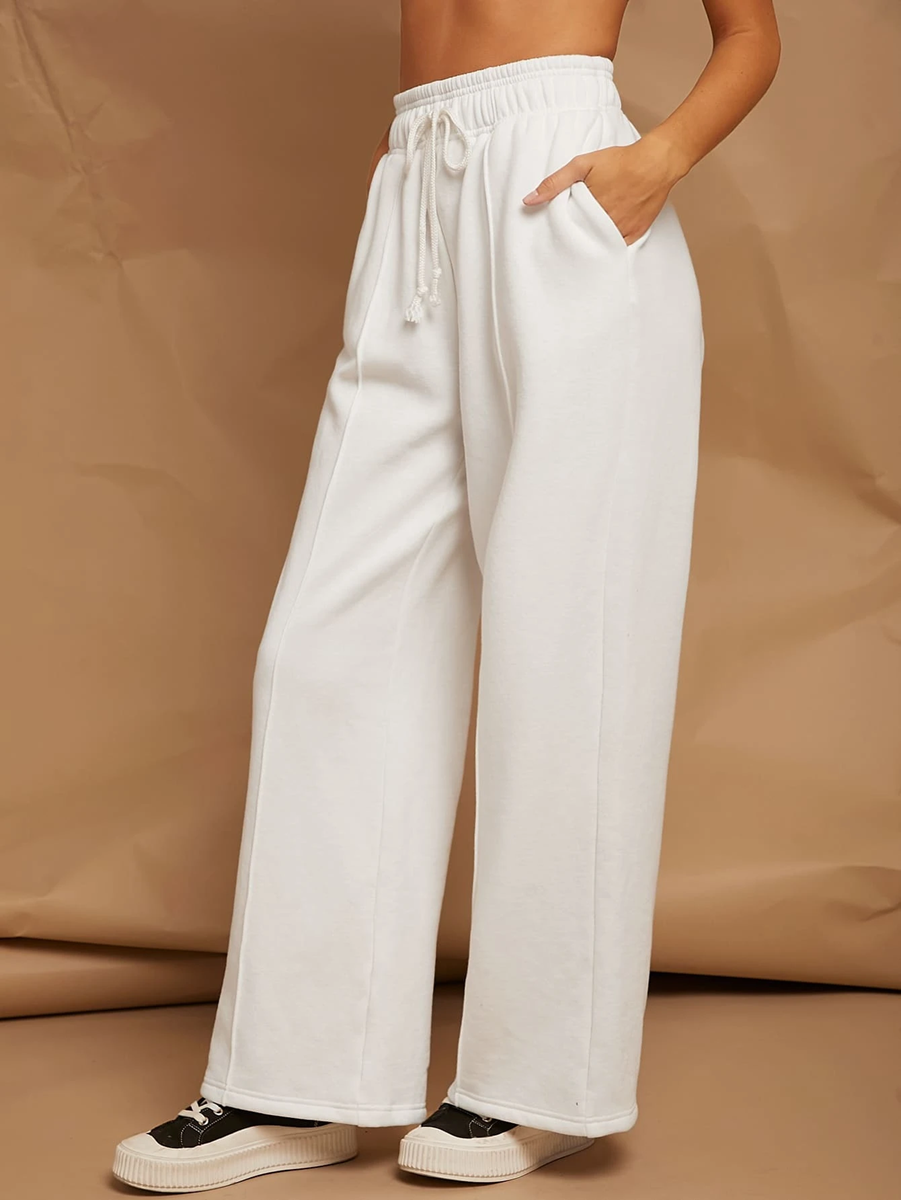 white broad pants with front pleat for athleisure