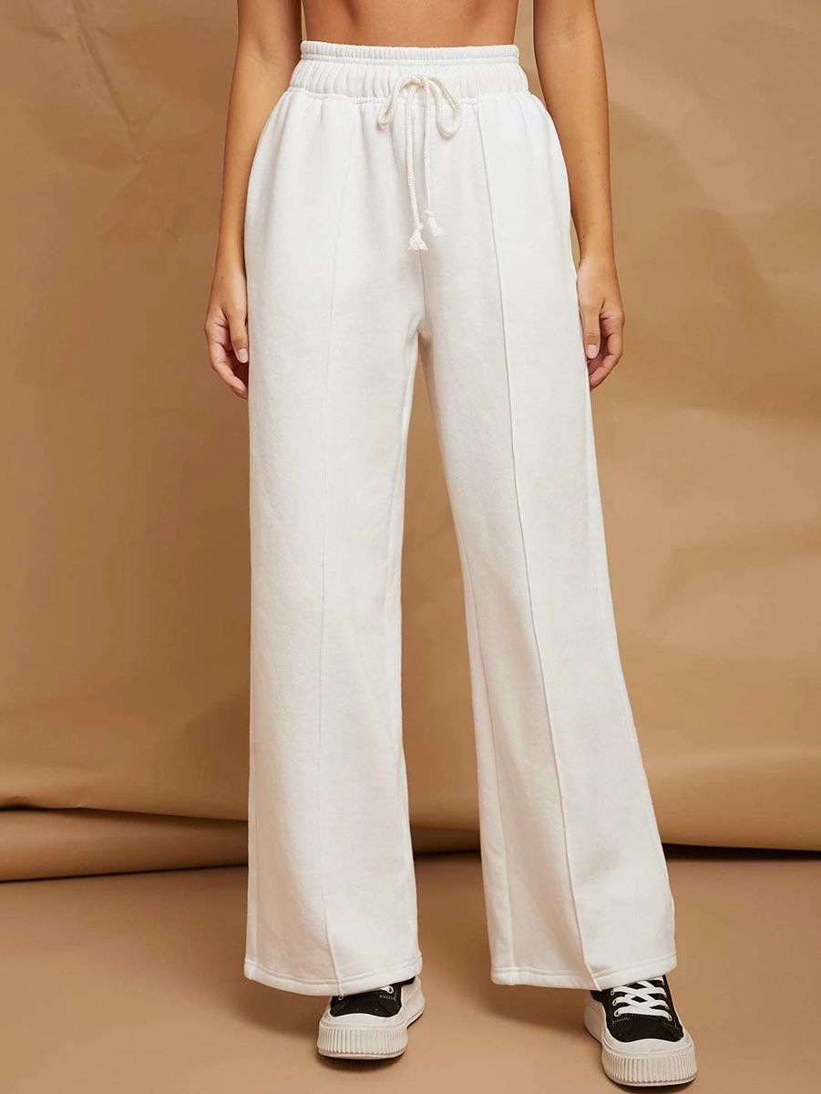 white broad pants with front pleat for athleisure